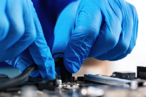 Hands work on a motherboard 스톡 사진