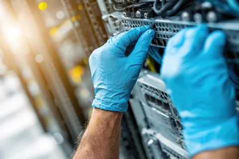 Hands work on server rack 스톡 사진