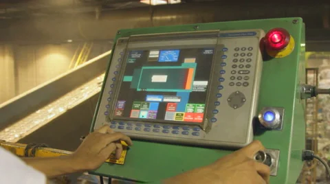 HANDS WORK TOUCHSCREEN AT RECYCLING PLANT Stock Footage 6530361