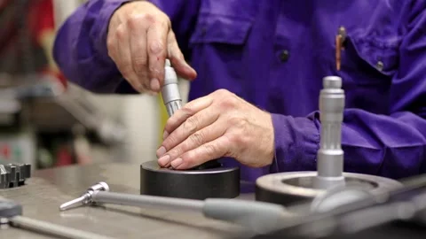 Hands of a worker assembling pieces of metal Stock Footage 257719135
