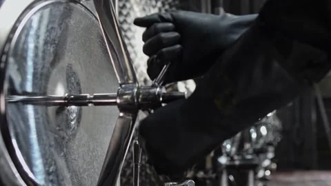 Hands of a worker in black rubber gloves rotate the tank hatch valve Stock Footage 270057979