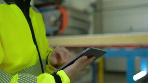 Hands of worker male engineer man businessman in hard hat using tablet computer Stock Footage 156232221