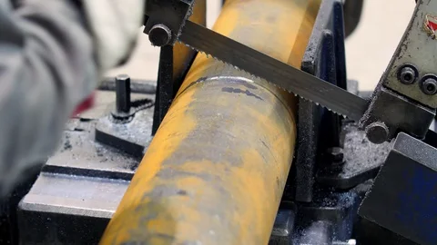 The hands of the worker measure the workpiece with a tape measure on a band saw Vídeo Stock 130105773