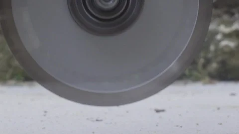 Hands of worker using professional electric concrete grinder. this cutting  tool Stock Footage 129024215