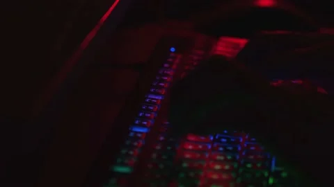 Hands working on claviarura in the dark. The hacker works at night. Computer Stock Footage 170336444