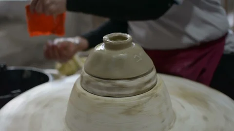 Hands working clay on potter's wheel. Stock Footage 123676577