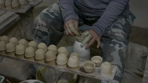 Hands working clay on potter's wheel. Stock Footage 123683781