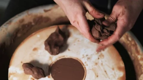 Hands working clay on potter's wheel. Potter shapes the clay product with potter Video stock 144069803