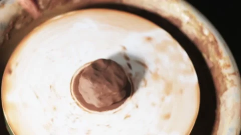 Hands working clay on potter's wheel. Potter shapes the clay product with potter Stock-Footage 144070241