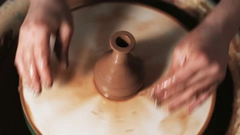 Hands working clay on potter's wheel. Potter shapes the clay product with potter Video stock 144072913