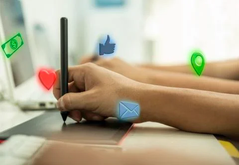 Hands working on computer with internet icons Stock Photos