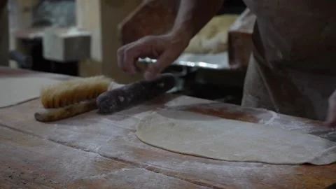 Hands working dough on table Stockbeeldmateriaal 345375526
