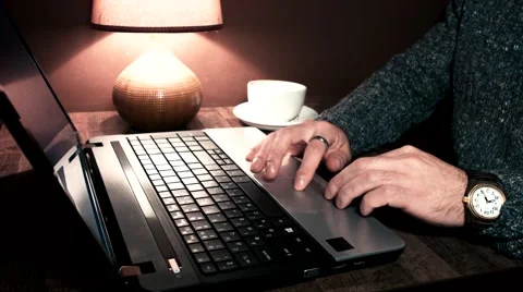 Hands working at a laptop and take a cup Stock Footage 56251083
