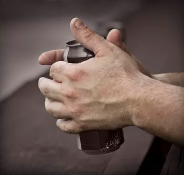 Hands of a working man Stock Photos