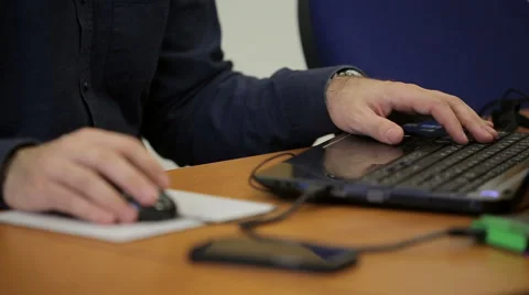Hands working with mobile phone and laptop Stock Footage 45125445