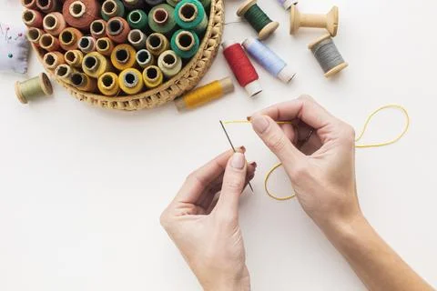 Hands working with needle sewing thread Stock Photos