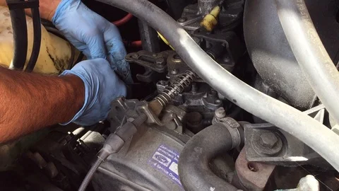 Hands working on old engine Stock Footage 94576076