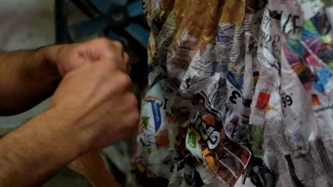 Hands working on paper mache Stockbeeldmateriaal 101652508