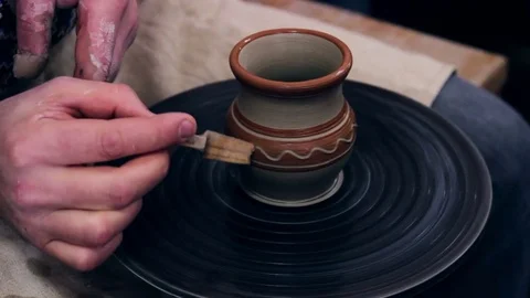 Hands working on pottery wheel Stock Footage 70803025