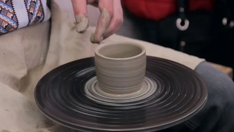 Hands working on pottery wheel Stock Footage 73783653