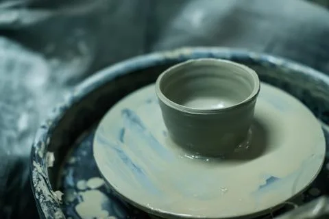 Hands working on pottery wheel Stock Photos