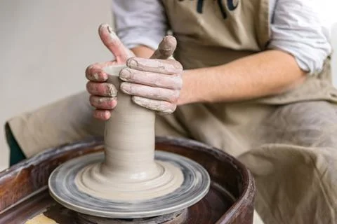 Hands working on pottery wheel Foto stock