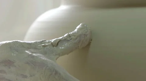 Hands working on pottery wheel, shaping a ceramics Stock-Footage 66063863