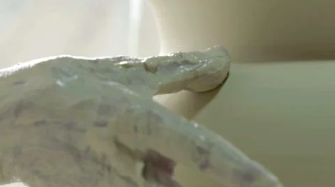 Hands working on pottery wheel, shaping a ceramics Stock Footage 66063869