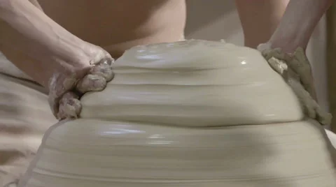 Hands working on pottery wheel, shaping a ceramics 動画素材 66063958