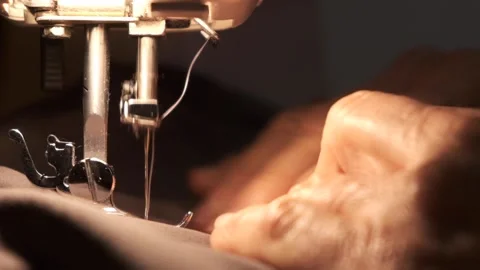 Hands working sewing machine in motion. close-up of sewing machine needle Stock Footage 228232334