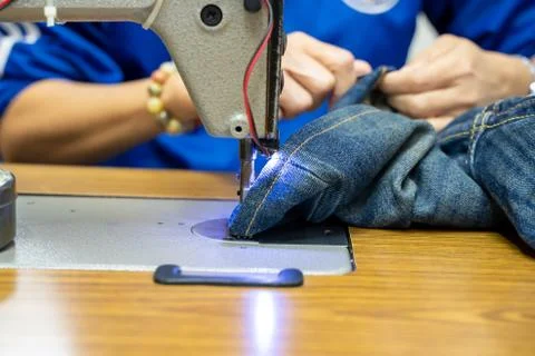 Hands working on the sewing machine Stock Photos