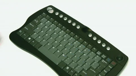 Hands working on small black keyboard on white Stock Footage 508048