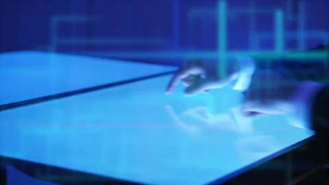 The hands working with a touchscreen screen on the hologram background Stock Footage 100560024