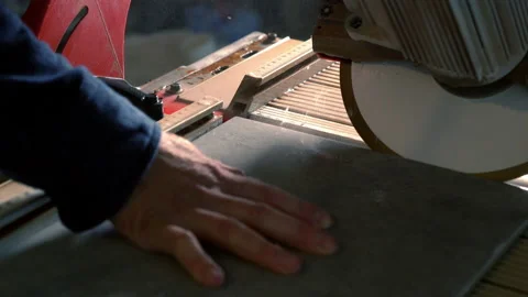 Hands of a workman cutting a bevel on a tile Video stock 142105742