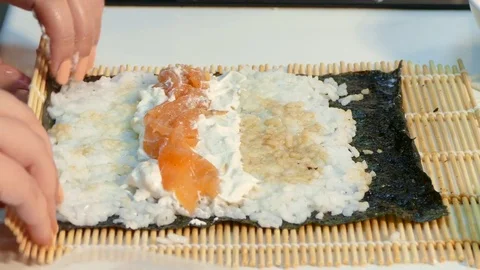 Hands wrap the sushi roll Video stock 85422865