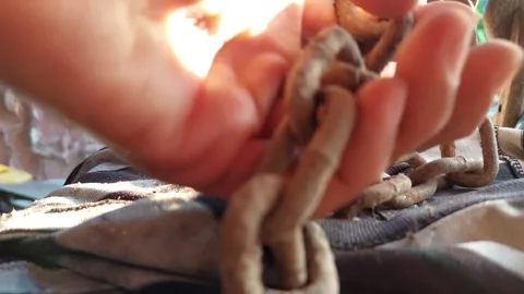 Hands wrapped in chains Stock Footage 261929939