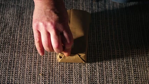 Hands wrapping gift in brown paper Stock Footage 296597305