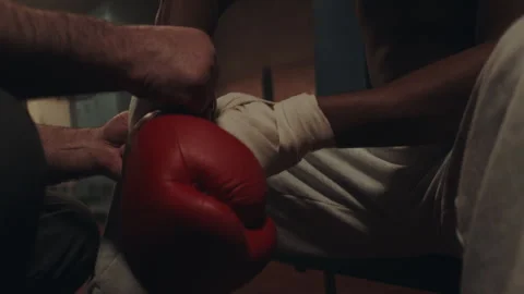 Hands Wraps on a boxer and the gloves Stock Footage 282987929
