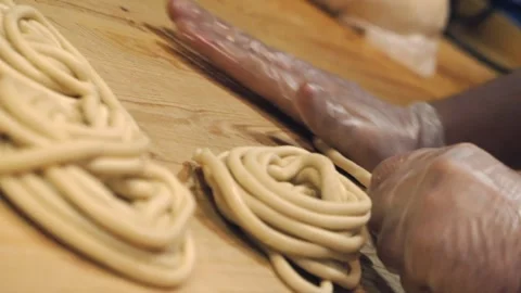 Hands wrinkle the dough. Stock Footage 131131047