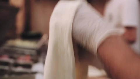 Hands wrinkle the dough. Stock Footage 134266352
