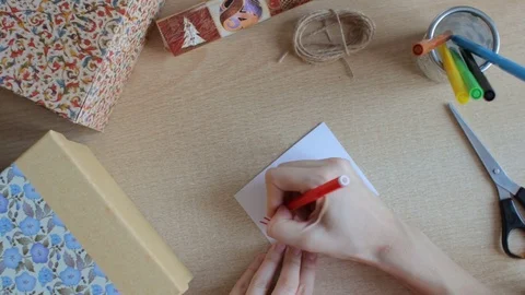 Hands write greeting card Stock Footage 72297595