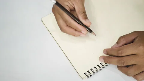 Hands write something on the notebook. Stock Footage 140487533