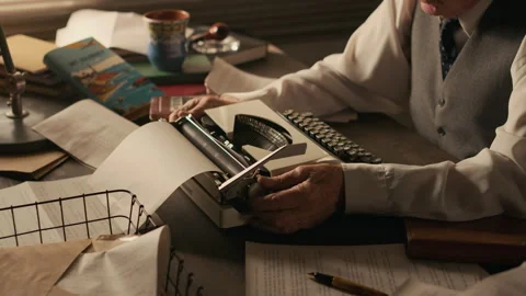 Hands of Writer Loading Paper into Vintage Typewriter Stock Footage 312156530