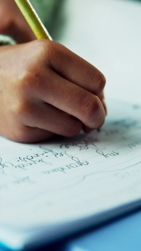 Hands, writing and child with homework in house for education, learning or Stock Footage 339160765