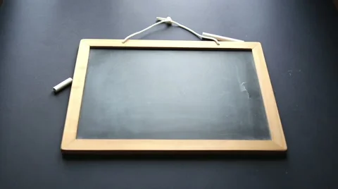 Hands writing on blackboard "list to do: be curious" Stock-Footage 56372354