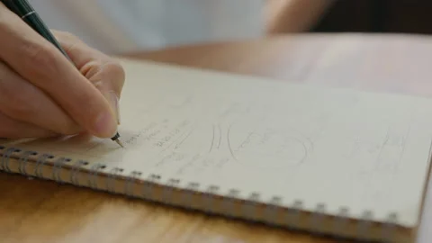 Hands Writing Business Notes in Copybook Stock Footage 235773731