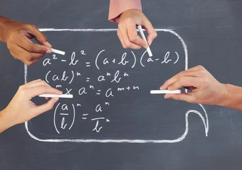 Hands writing equations on blackboard Stock Photos
