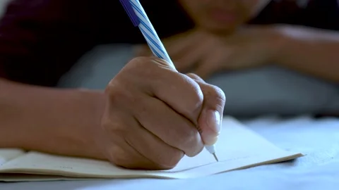 Hands writing on notebook Stock Footage 153338592