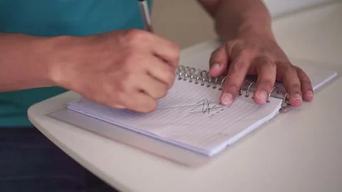 Hands writing in notebook, making mistake, crossing out text in frustration. Vídeos de archivo 339122314