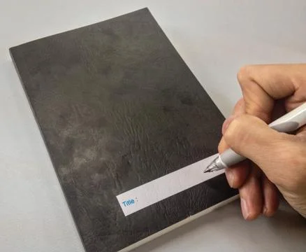 Hands writing notebook Stock Photos